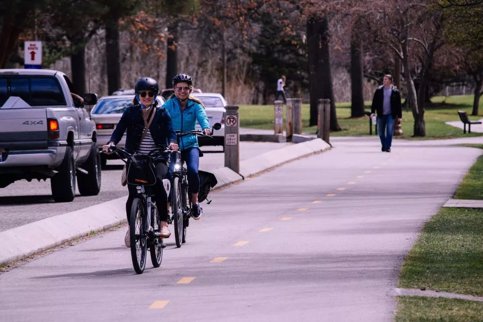 woman-riding-bicycles-on-road-World-Bike-Day-min-1-1600x1067