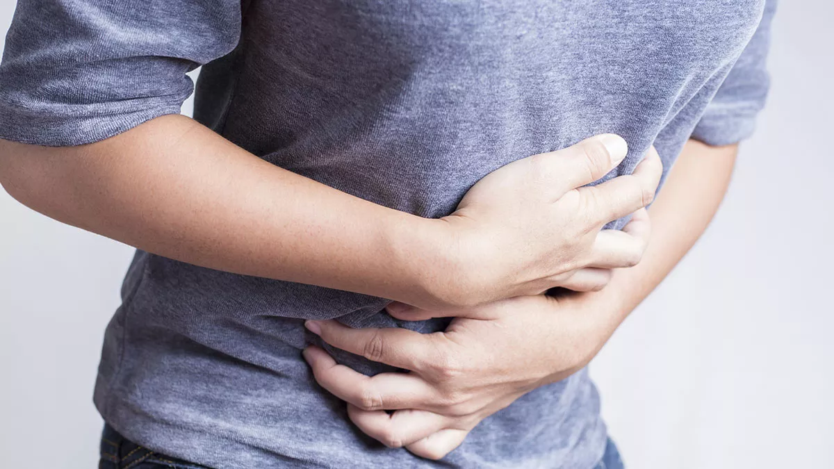 woman-holding-stomach-1200